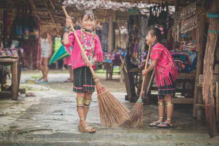 The hill tribe children swept the yard.
